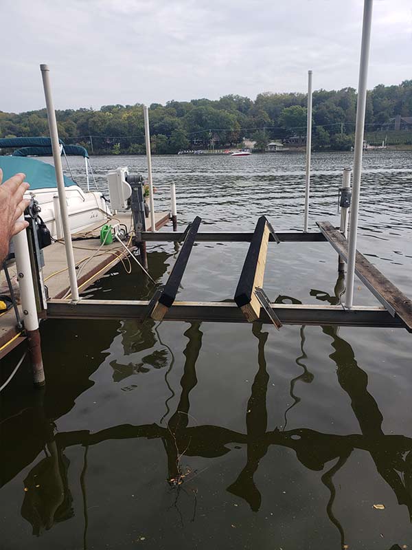 pier1 a boat lift in the water